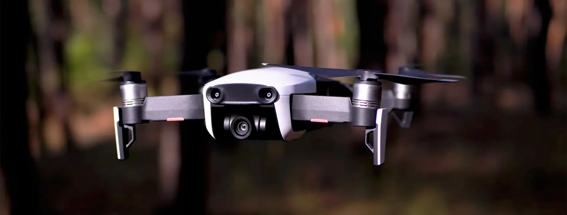 A black and white drone with a camerea.